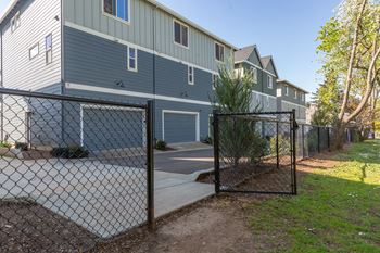 Fenced parking area with residential